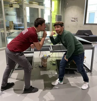 Two brainboost team members at the Carrera track in the Deutsches Museum Nuremberg