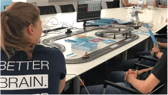 NeuroRacing: a Carrera racing track controlled by brain activity at a health day
