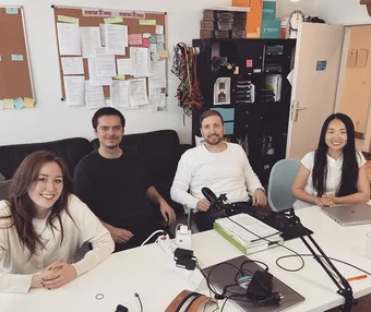 The brainboost project team at a meeting table in the office